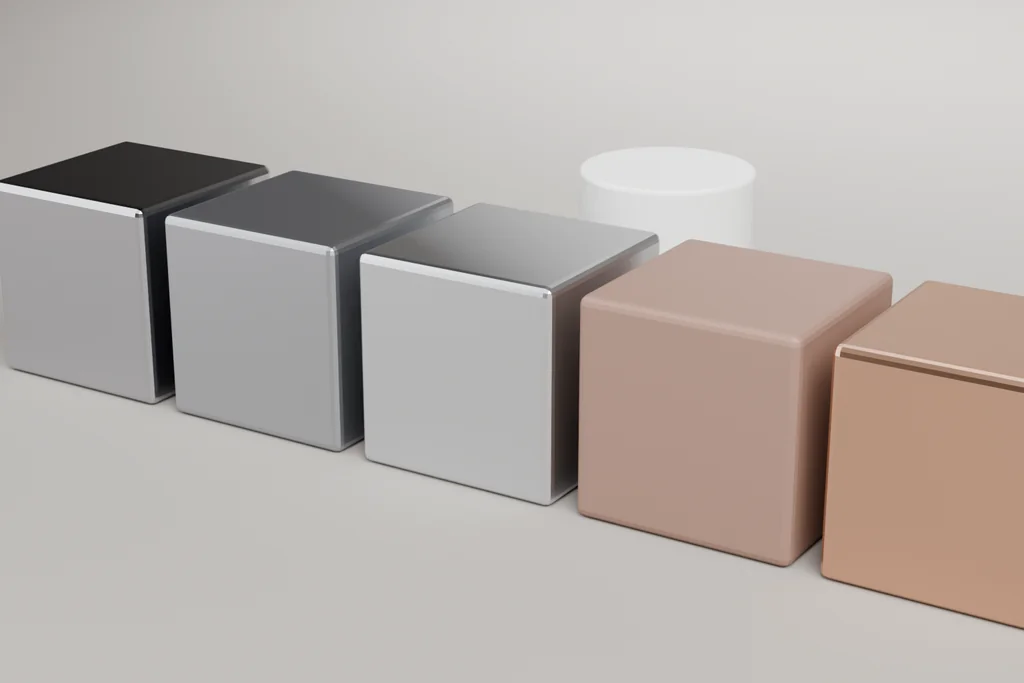 Six material samples on a bench: bright steel, worn steel, aluminium, oxide-finished iron, copper and white Delrin.