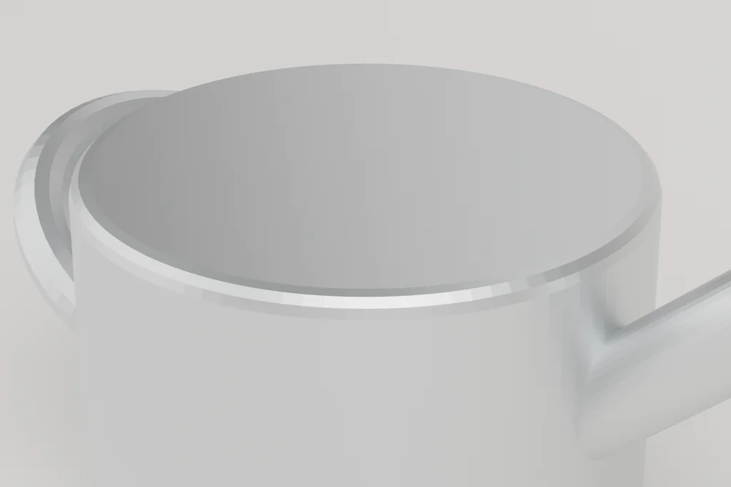 Close view of a zinc watering can showing the seamed body, the handle fixing and the spout joint.
