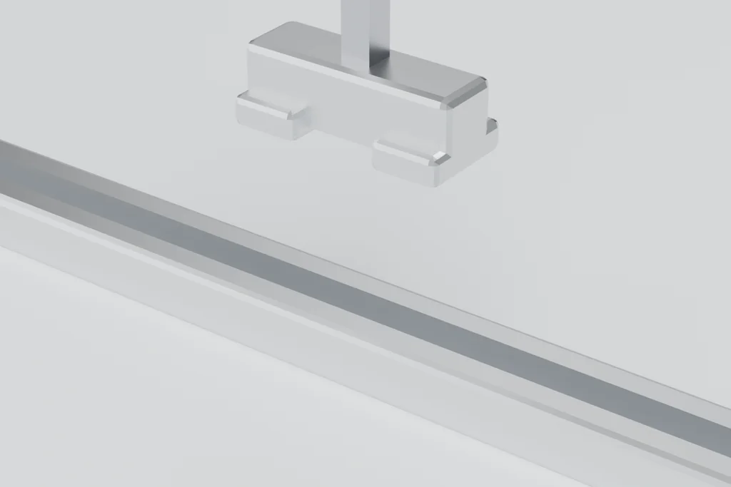 Close view of a mid-clamp seated on an extruded rail, showing the wings and the bolt.