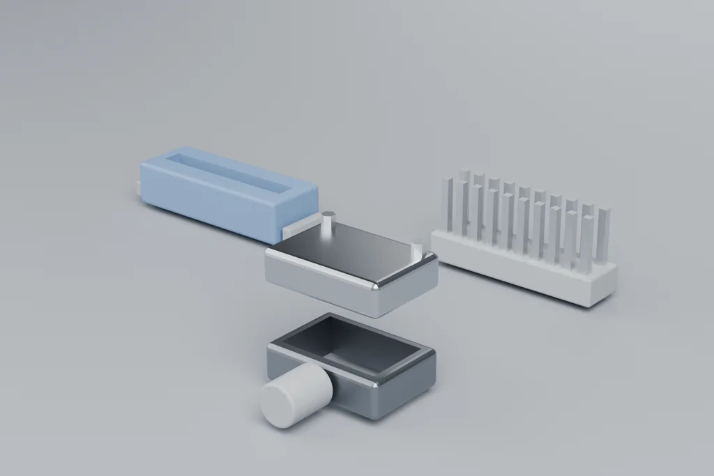 A blue ribbon IDC connector with its contact row, a two-row pin header, and a two-part shielded backshell.