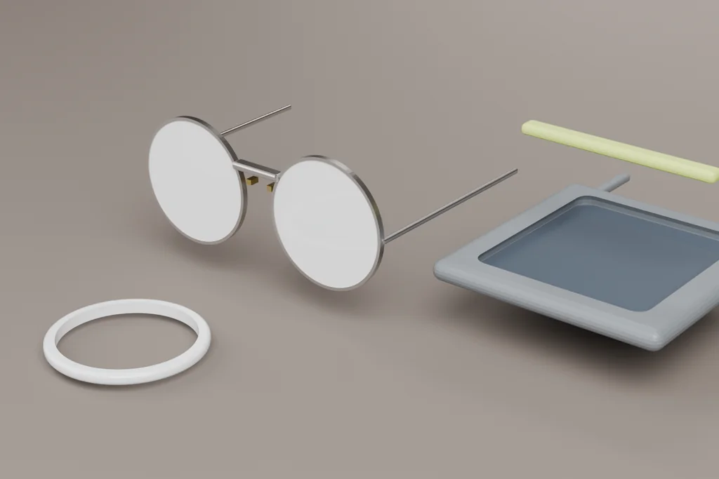 Three sport eyewear parts: a rimless mount, a wrapped shield frame and a semi-finished lens blank.