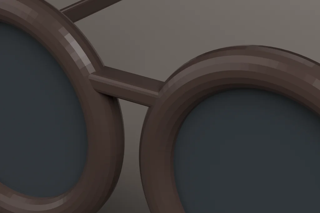 Close view of an acetate frame showing the rim, the keyhole bridge and the hinge.