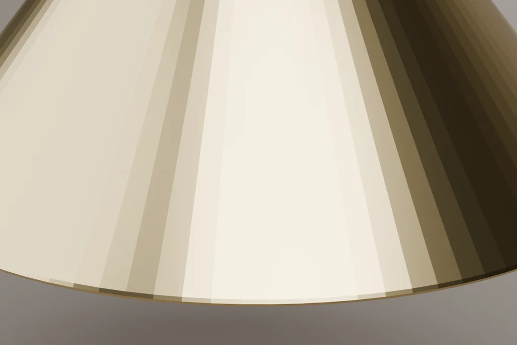 Close view of a brass pendant shade showing the rolled rim, the recessed lamp and the matte interior.